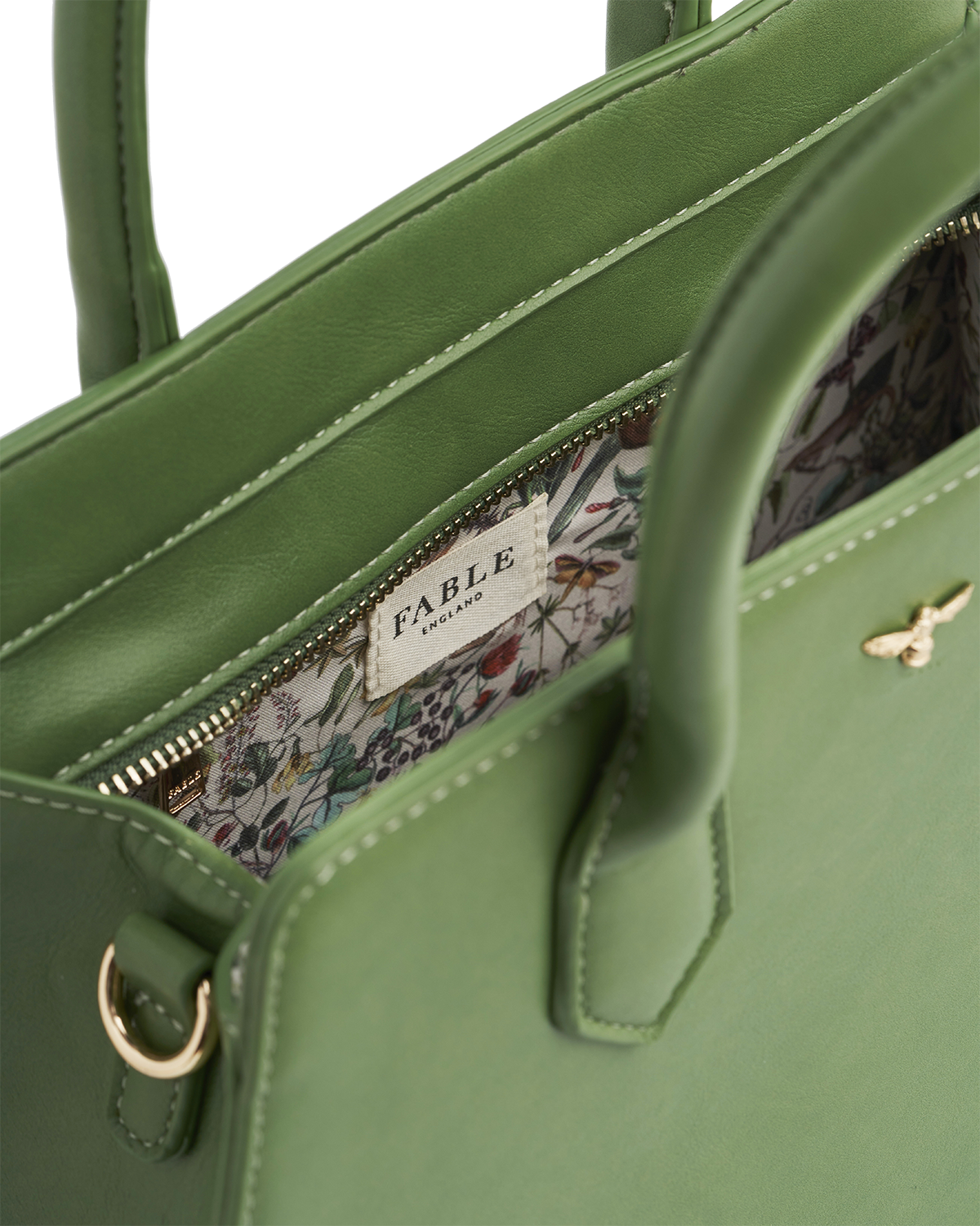 Green handbag with print inside and fable label
