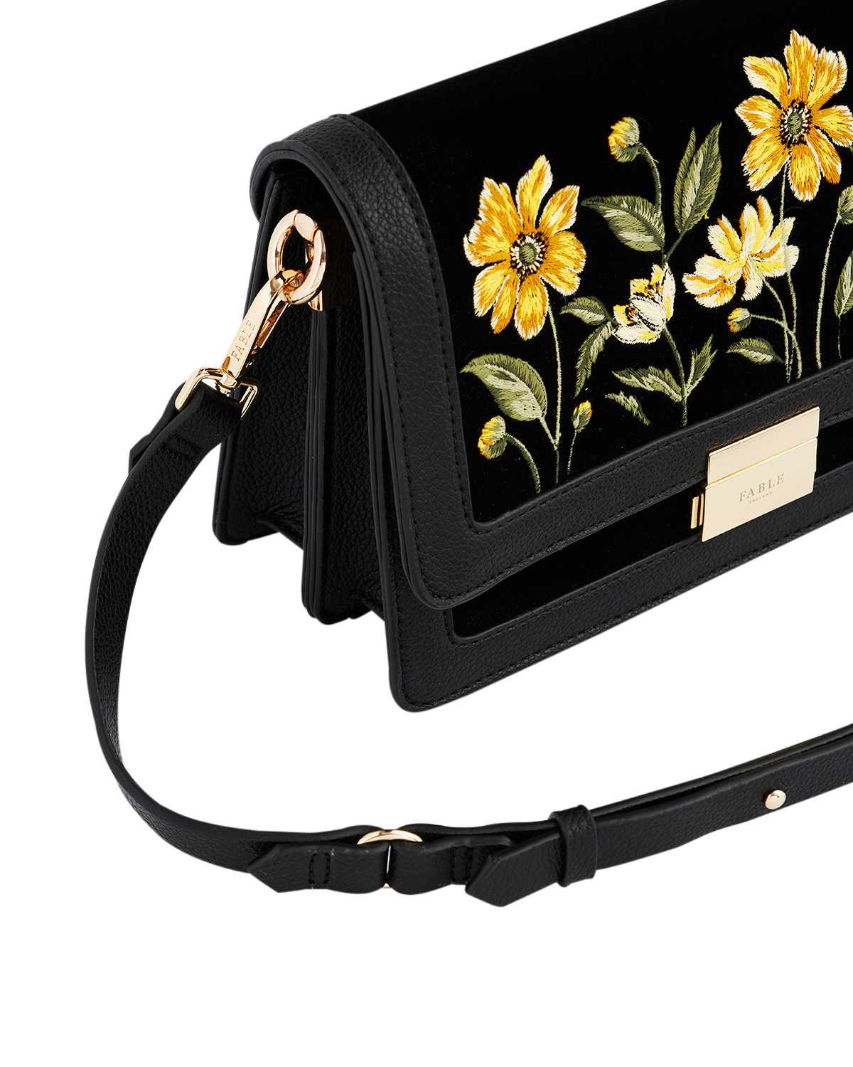 Black handbag with floral embroidery on a white background