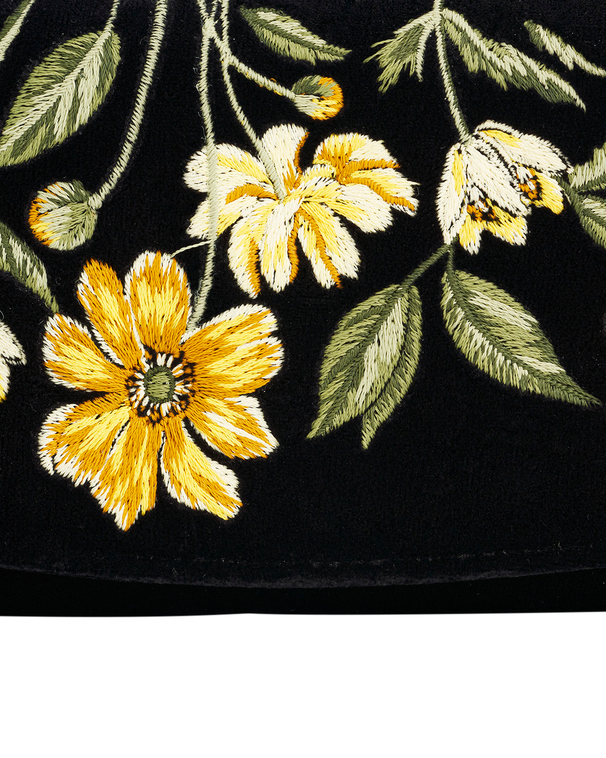 Embroidered yellow flowers and green leaves on a black background