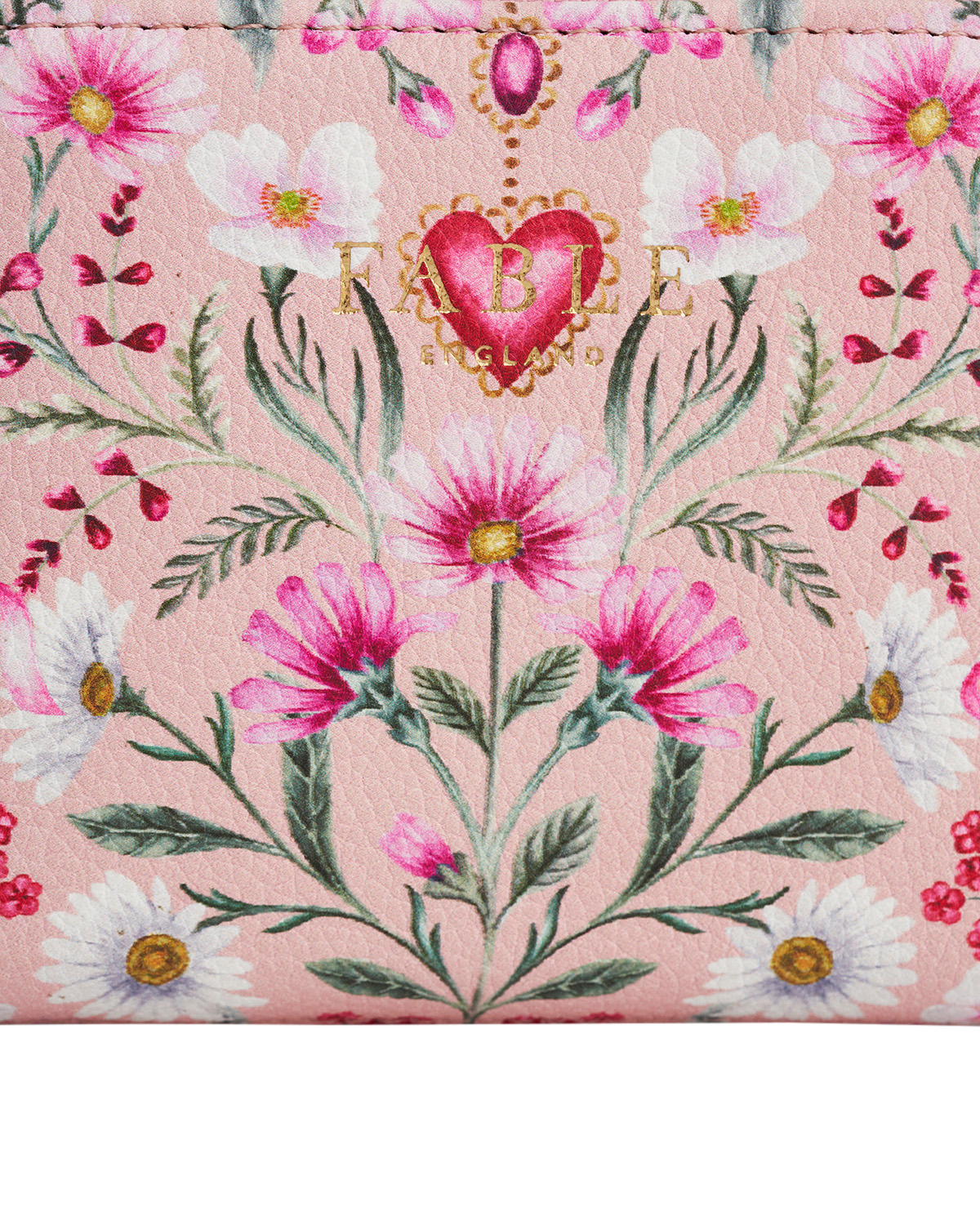 Floral patterned product with a brand logo on a pink background