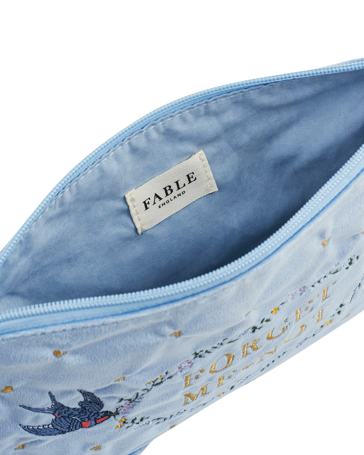 Interior view of the Blue Forget Me Not Velvet Embroidered Pouch showcasing its soft velvet and embroidery.