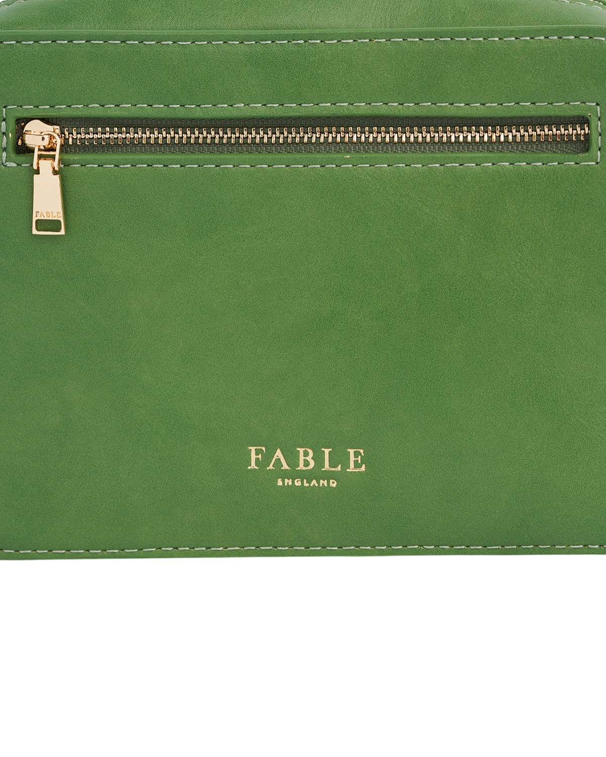 Green leather clutch bag with gold zipper and 'Fable England' branding.