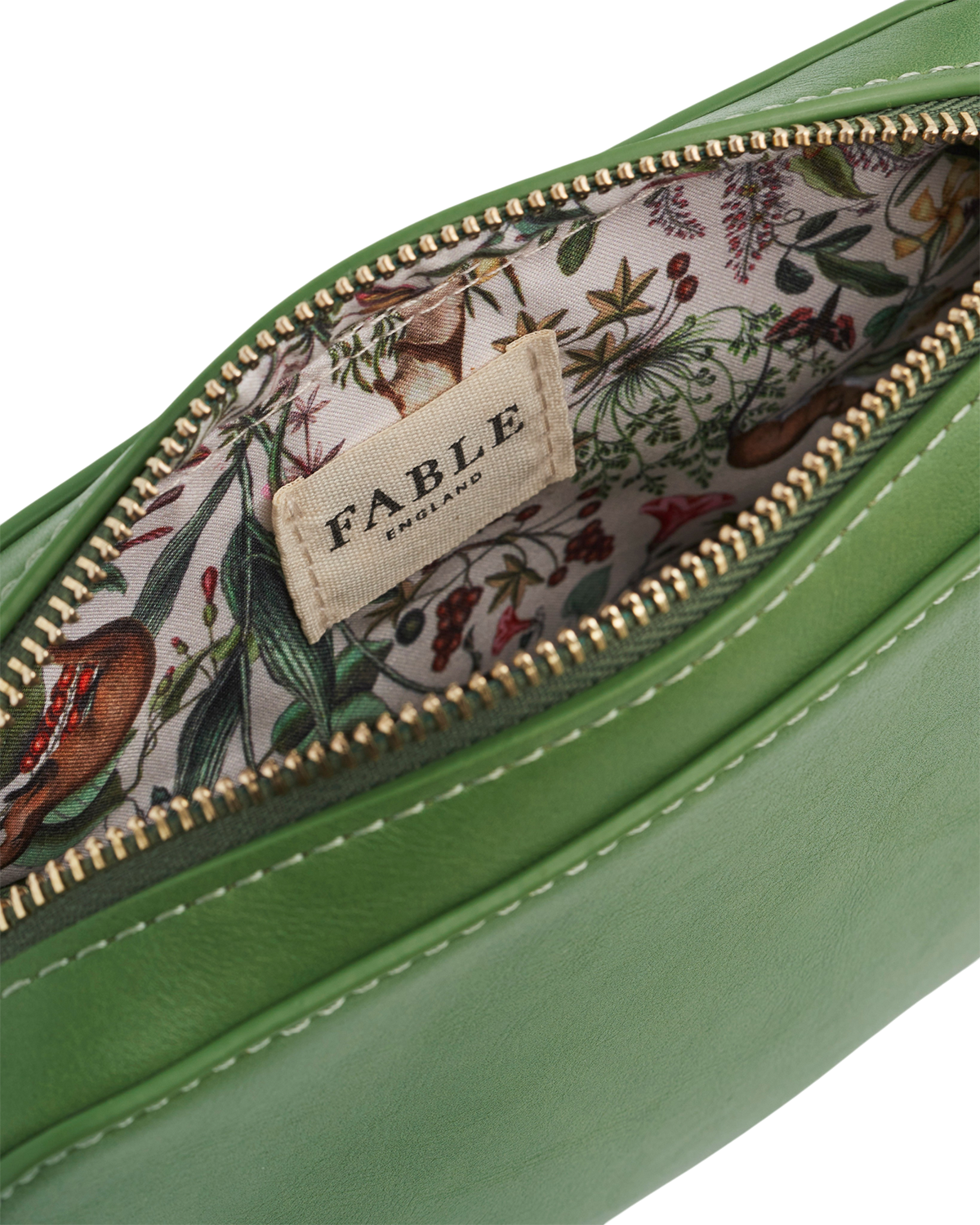Green leather pouch with floral interior and Fable brand label