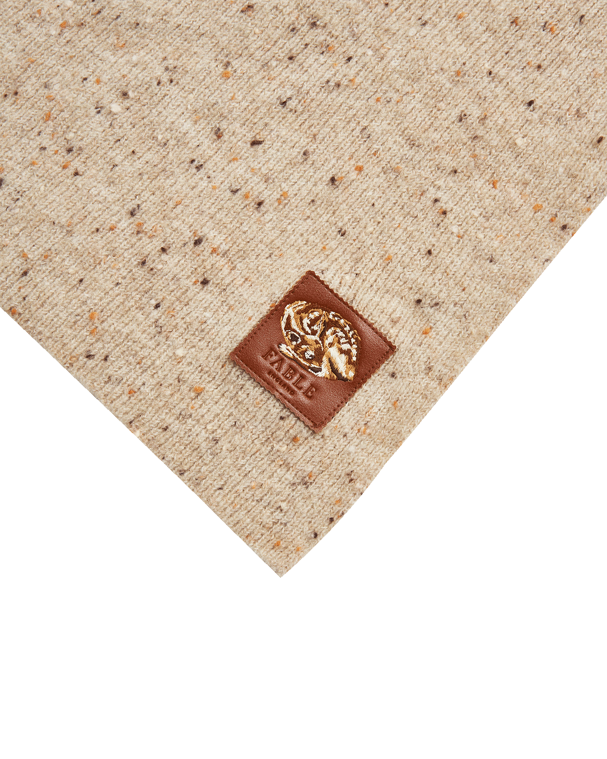 taupe fabric with a brown Fable England logo patch on a white background