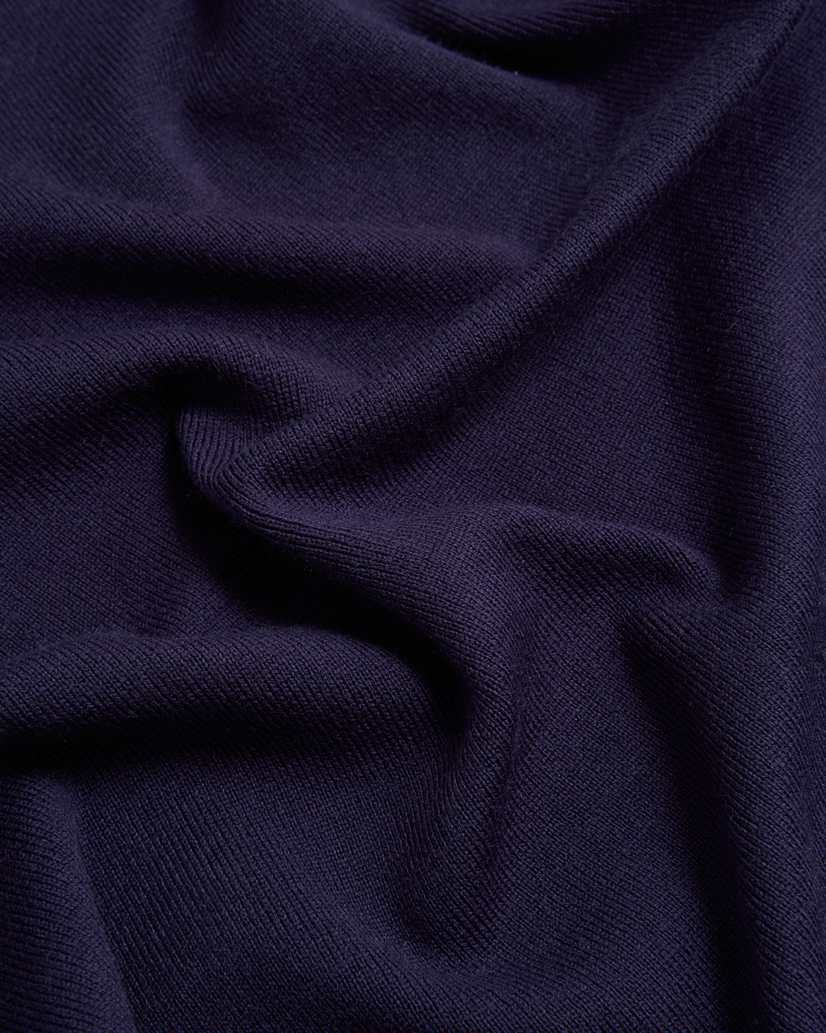 Close-up of dark blue fabric with folds