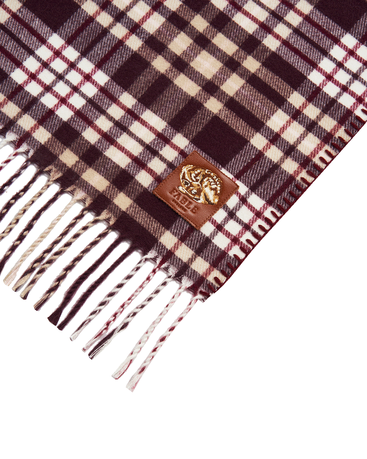 Plaid cape with fringes and a Fable England brand logo on a white background