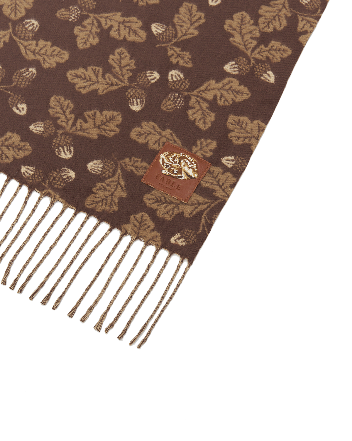 Brown scarf with leaf pattern and fringes on a white background