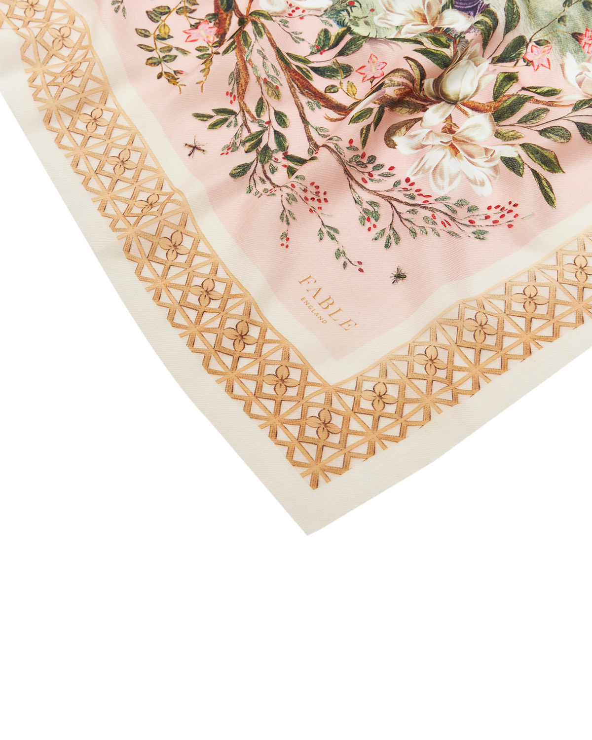 Floral patterned fabric with gold border and 'Fable' branding on a white background