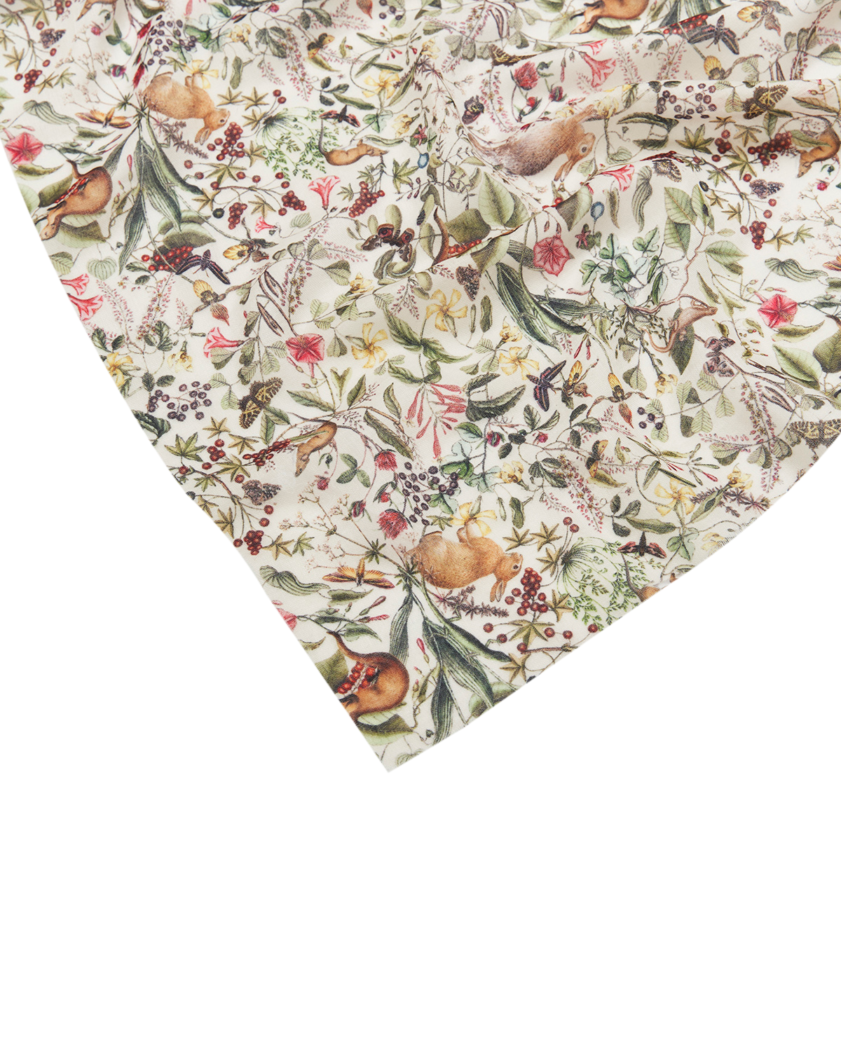 Fabric with nature-themed pattern featuring birds, flowers, and leaves on a white background