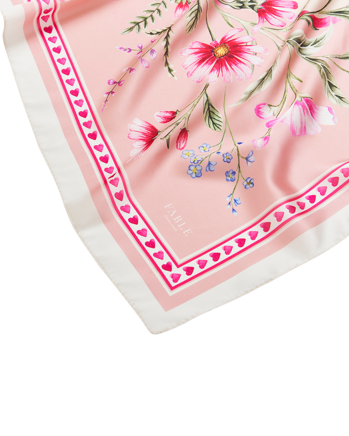 Pink Penelope Square Scarf featuring colorful floral design and heart trim on a soft pink background.