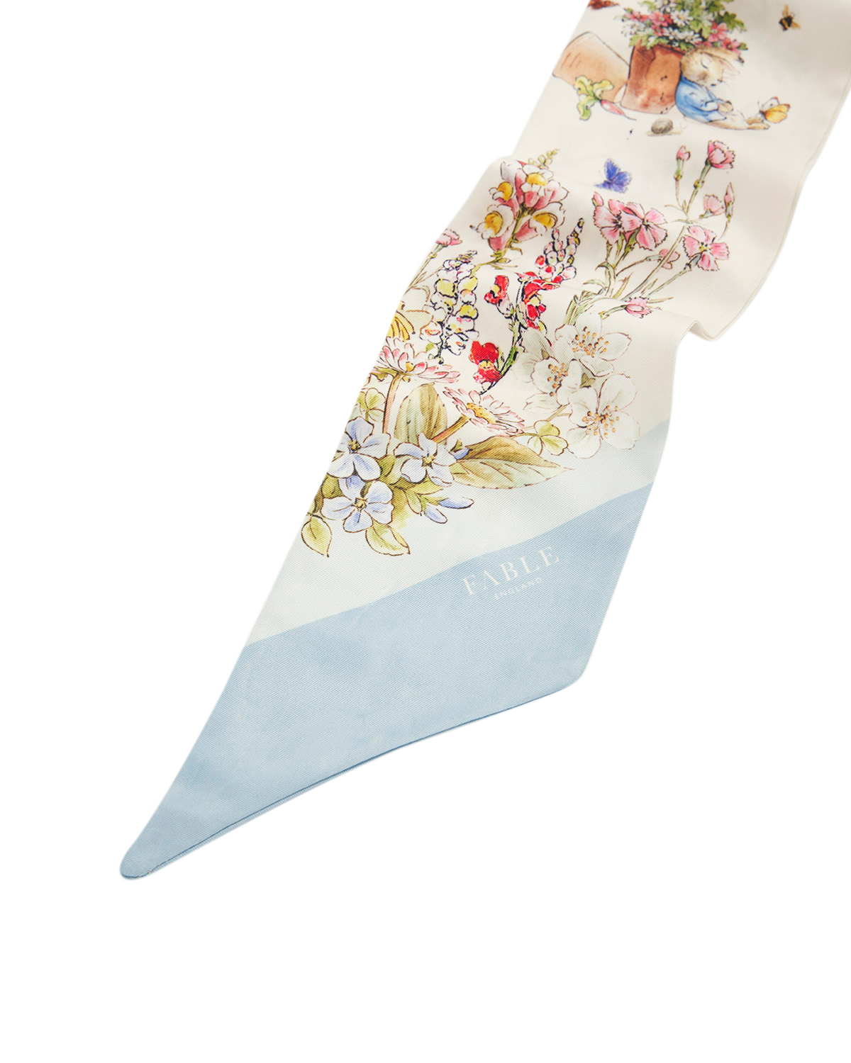 Scarf with floral and peter rabbit design on a white background