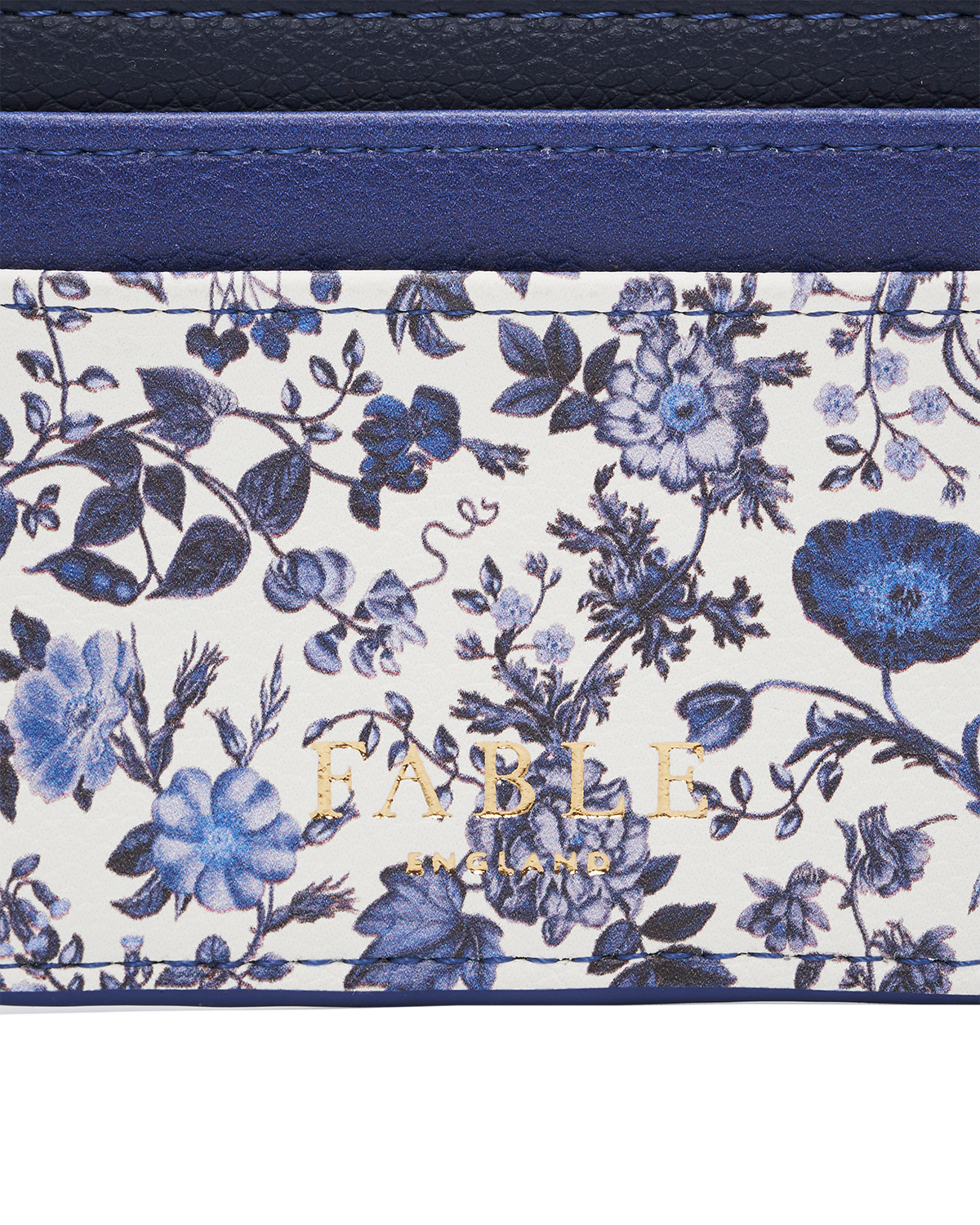 Blue Agnes Ditsy Card Holder featuring floral design in blue and white with gold Fable logo.