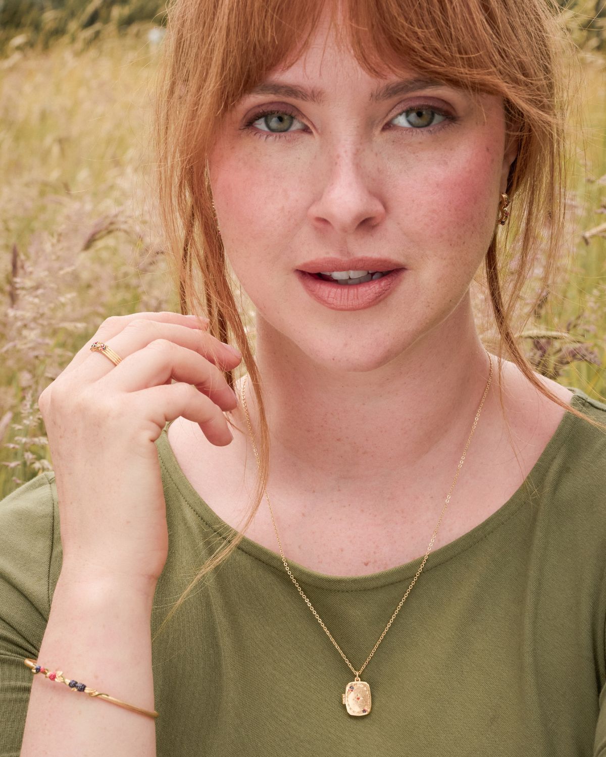 Model wearing the Orla Hedgerow Locket Necklace and Orla Hedgerow Bangle in Gold