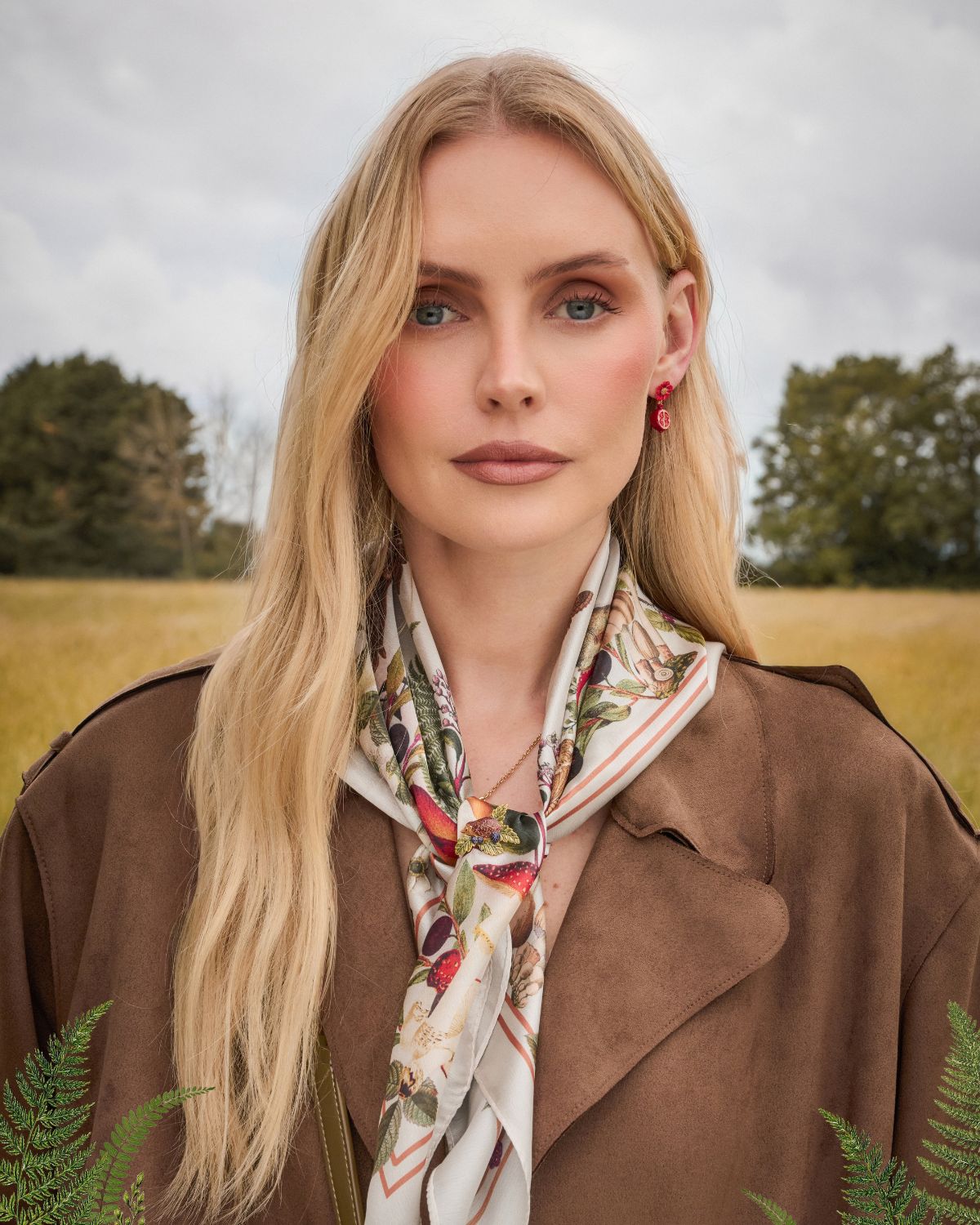 Model wearing the Orla Mushroom Scarf in Ivory with Blossom & Pomegranate Drop Earrings in Gold