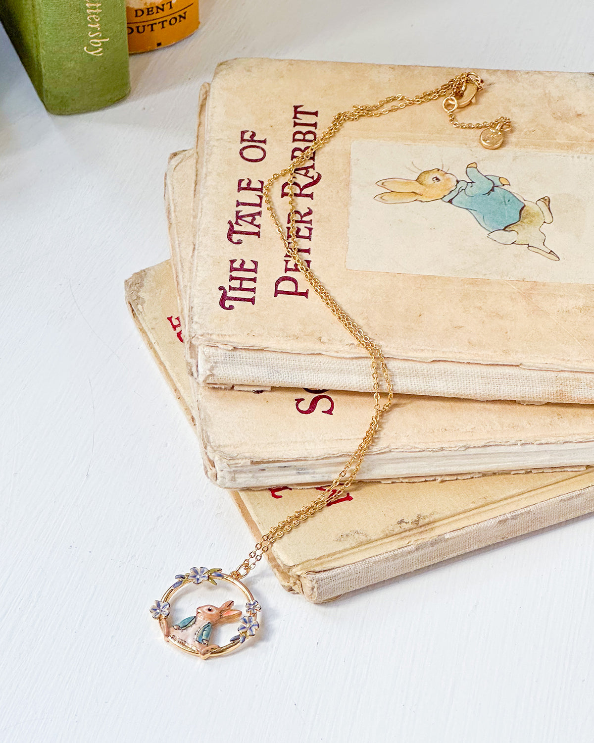 Gold enamel peter rabbit and forget me not flower necklace