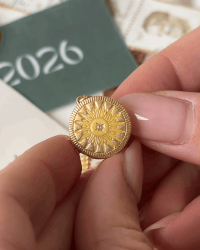 gold sun enamel circle locket on fine chain necklace