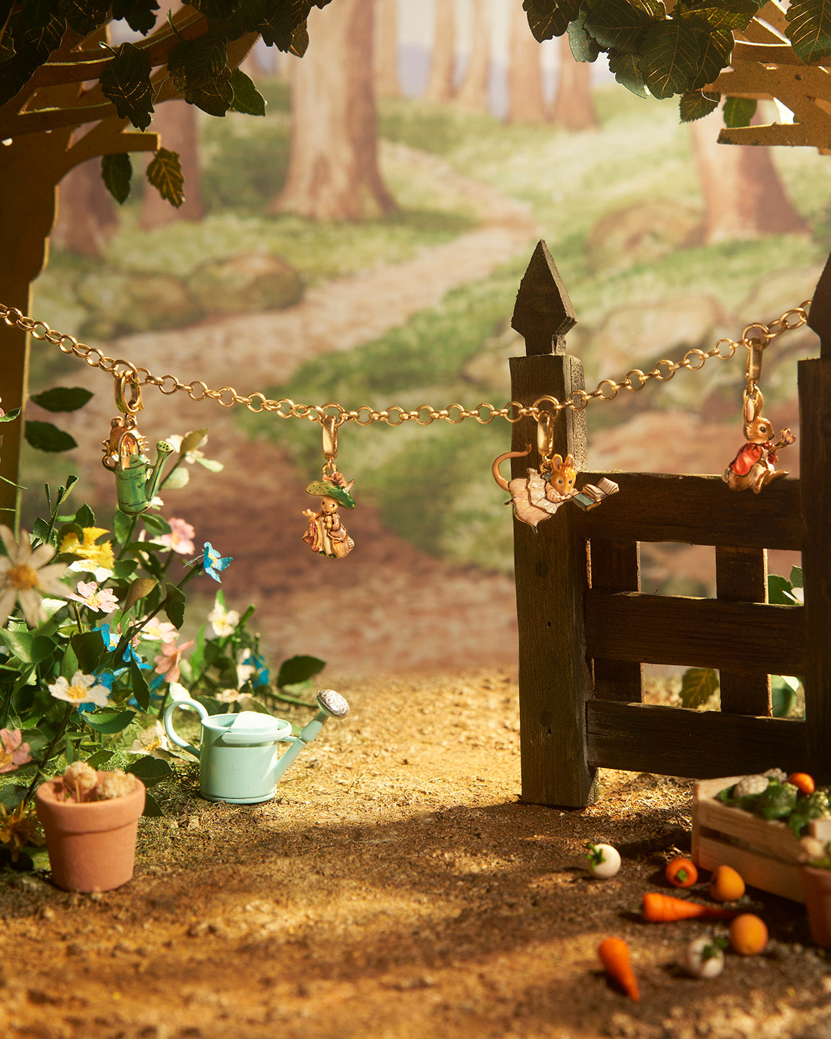 Miniature garden scene with a wooden gate, flowers, and small vegetables in a forest setting.