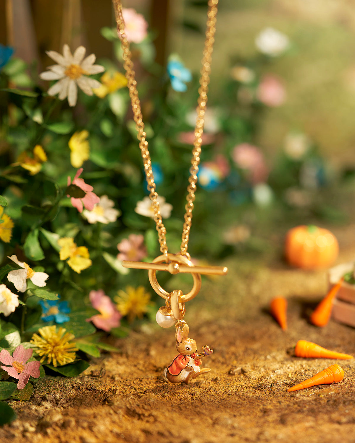 Flopsy charm on gold toggle necklace with faux pearl