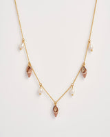 Spiral Shell Charm & Pearl Worn Gold Necklace by Fable England